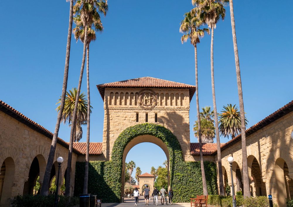 The main quad at Stanford University, seen through the arch under the clock tower.